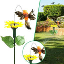 Solarer tanzender Kolibri mit Sonnenblume