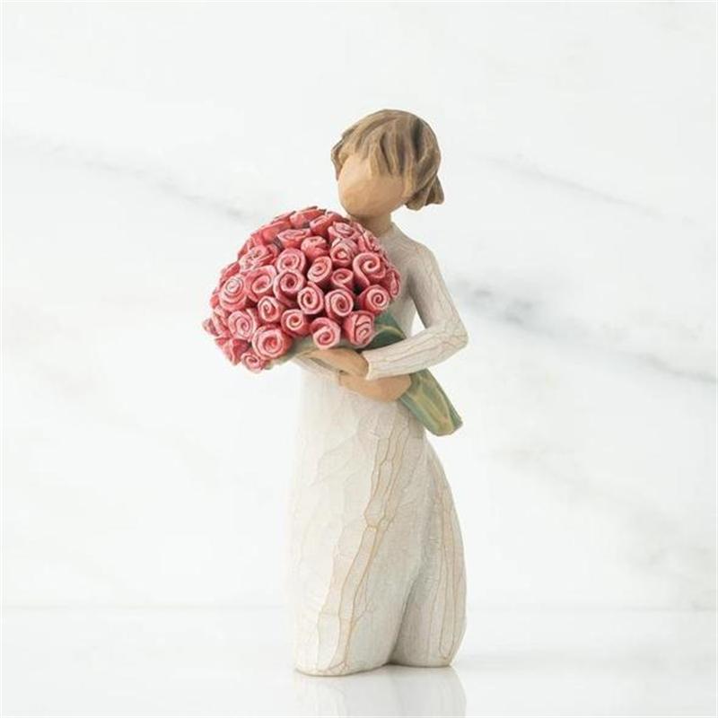 Ornamenti di figure con bouquet di fiori