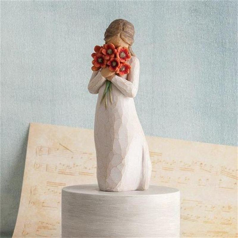 Ornamenti di figure con bouquet di fiori