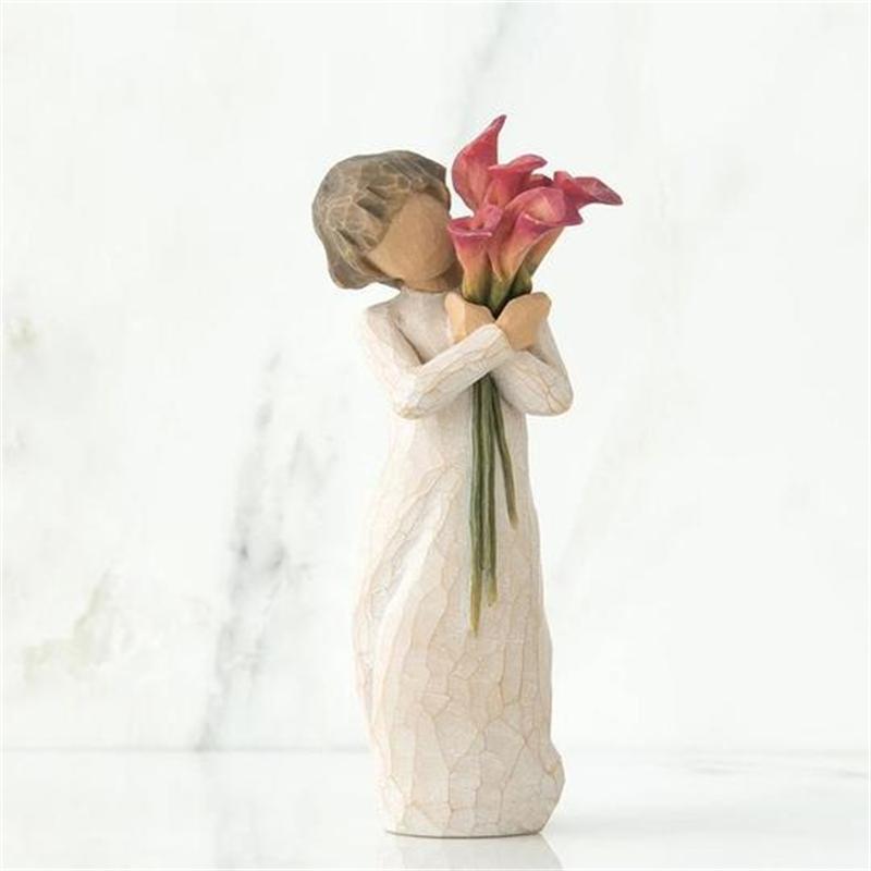 Ornamenti di figure con bouquet di fiori